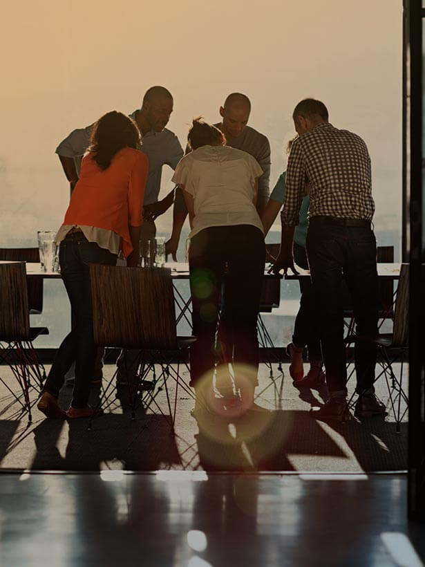 people conversing around a table